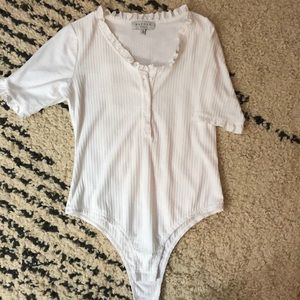 NWOT white body suit top with ruffles